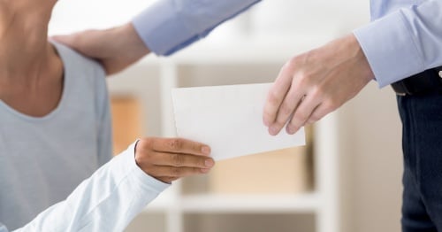 Exchanging a gift envelope.