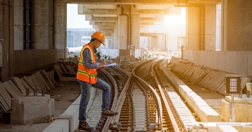 Worker at train junction.