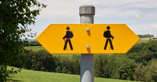 Two directions walking sign.
